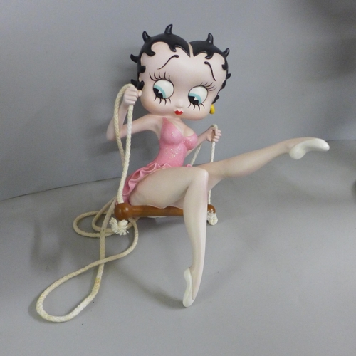 778 - One Fleish Betty Boop in a swing figure and a medium size Fleish Betty Boop with serving tray, 53cm