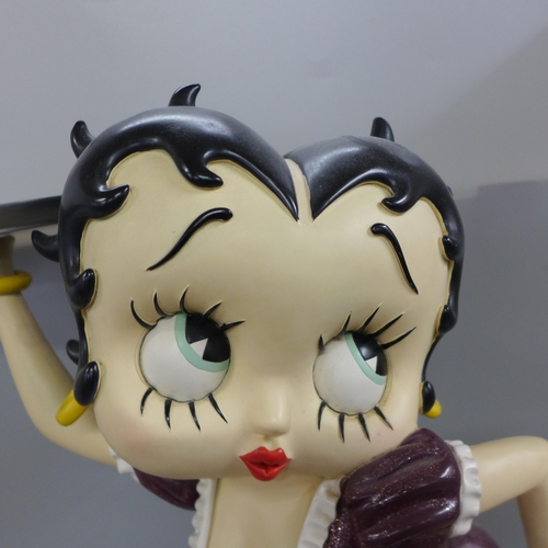 778 - One Fleish Betty Boop in a swing figure and a medium size Fleish Betty Boop with serving tray, 53cm