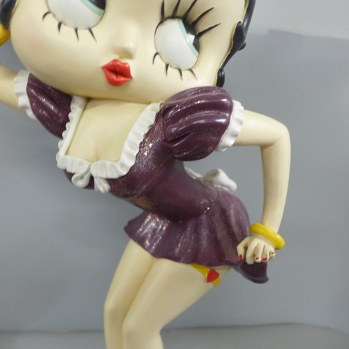 778 - One Fleish Betty Boop in a swing figure and a medium size Fleish Betty Boop with serving tray, 53cm