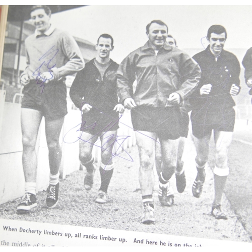 798 - A Charles Buchans 1968 football annual, extensively autographed with signatures including Roger Hunt... 