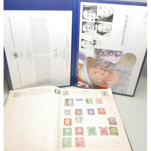 799 - A Golden Jubilee silver presentation coin, and The Improved Postage Stamp album containing worldwide... 