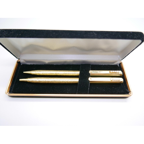 809 - A ballpoint pen and pencil set with Austrian crystals, with certificate of authenticity and box, (in... 