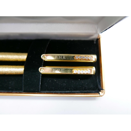 809 - A ballpoint pen and pencil set with Austrian crystals, with certificate of authenticity and box, (in... 