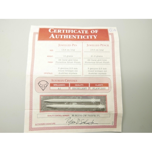 809 - A ballpoint pen and pencil set with Austrian crystals, with certificate of authenticity and box, (in... 