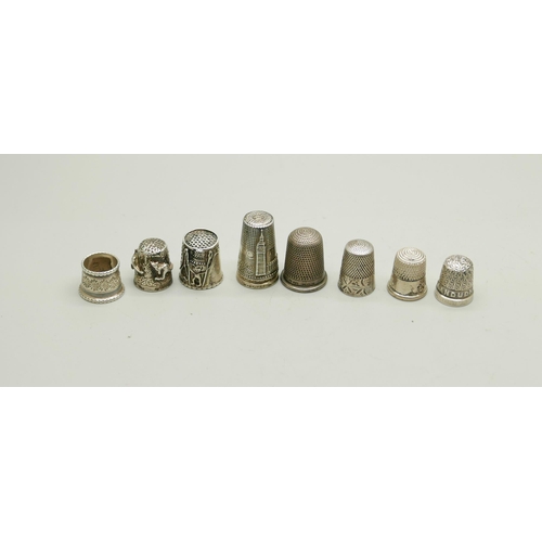 822 - A collection of nine silver thimbles, 53g