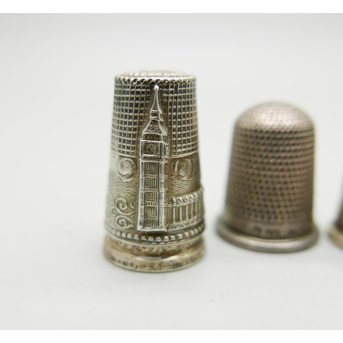 822 - A collection of nine silver thimbles, 53g