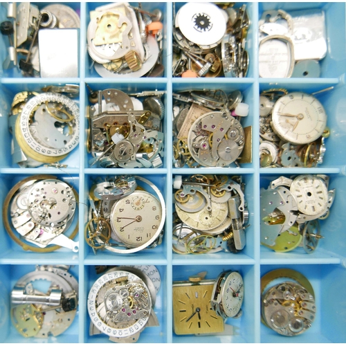 833 - A collection of watch movements, parts and dials including Omega, Tissot, Tag Heuer, Smiths, etc.