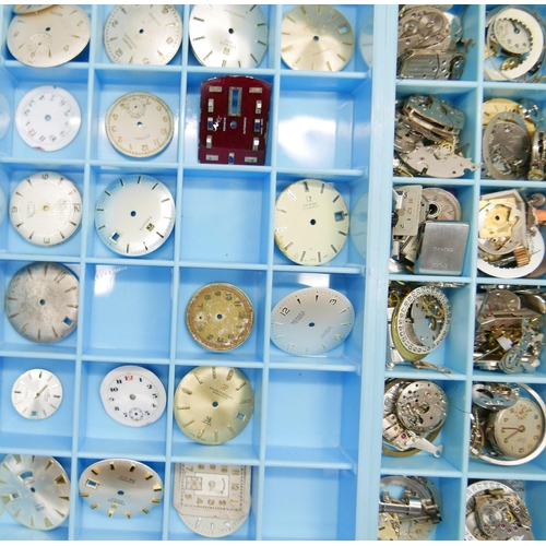 833 - A collection of watch movements, parts and dials including Omega, Tissot, Tag Heuer, Smiths, etc.