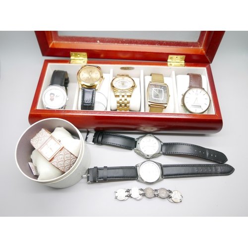 842 - A collection of watches in a display box including Sekonda, a lady's Monsoon watch, boxed, and a hal... 