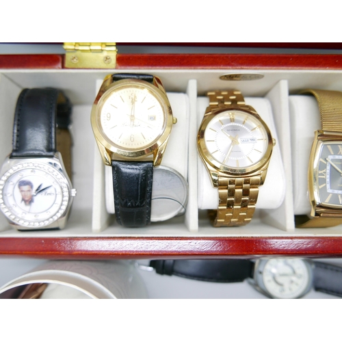 842 - A collection of watches in a display box including Sekonda, a lady's Monsoon watch, boxed, and a hal... 