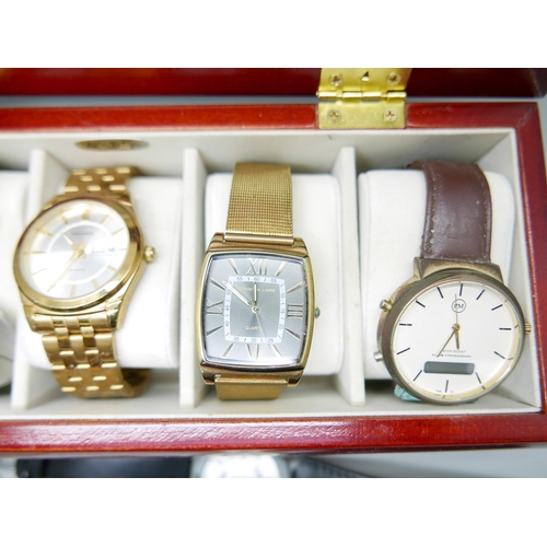 842 - A collection of watches in a display box including Sekonda, a lady's Monsoon watch, boxed, and a hal... 