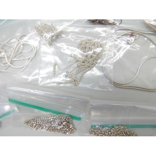893 - Thirteen silver chains, 39g, and two silver plated chains