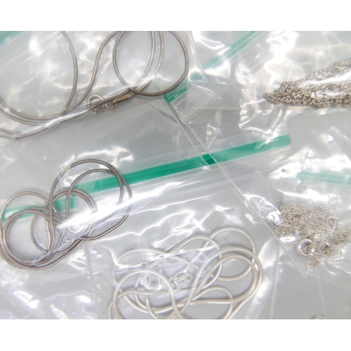 893 - Thirteen silver chains, 39g, and two silver plated chains