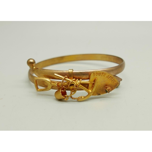 900 - A Victorian unmarked rolled gold South Africa mining bangle, in a fitted case