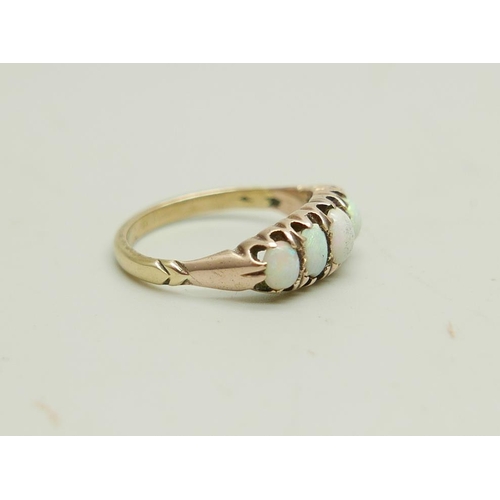 903 - A 9ct gold ring set with five opals, 3g, N