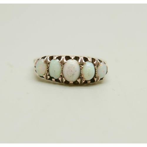 903 - A 9ct gold ring set with five opals, 3g, N