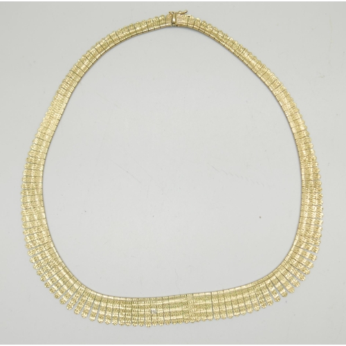 906 - A 9ct gold fringe necklace with textured design, 44.5cm, 22g