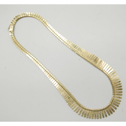 906 - A 9ct gold fringe necklace with textured design, 44.5cm, 22g