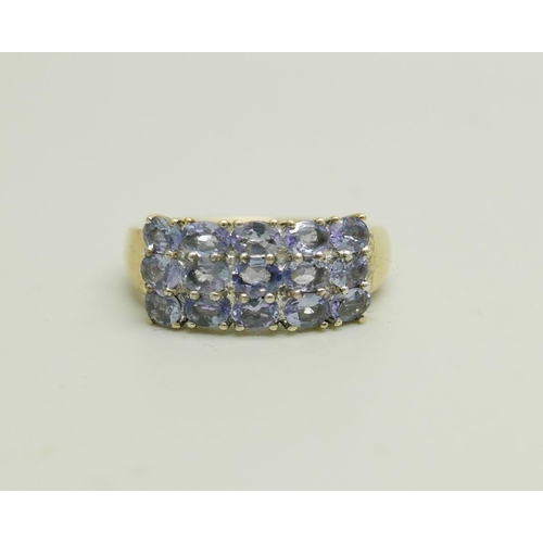 907 - A silver gilt three row tanzanite ring, N