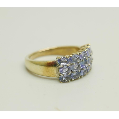 907 - A silver gilt three row tanzanite ring, N