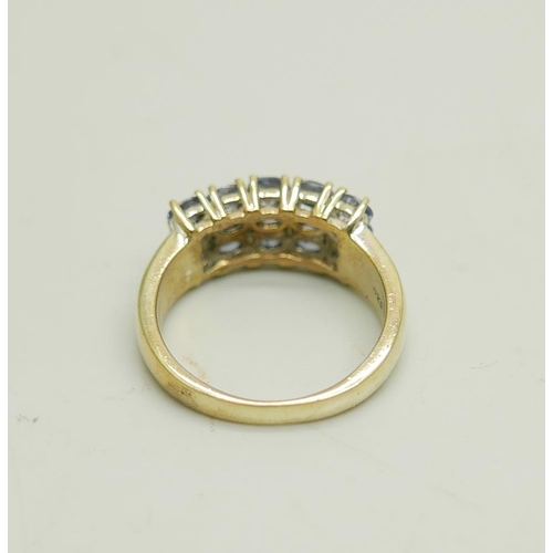 907 - A silver gilt three row tanzanite ring, N