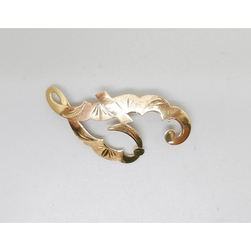935 - An 18ct gold brooch stamped 750, 4.3cm, 2.3g