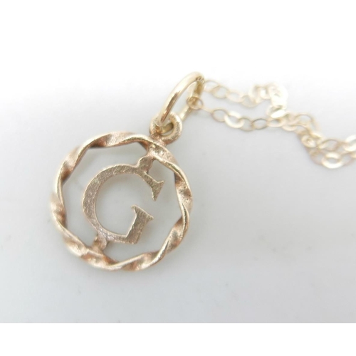 936 - Three 9ct gold chains and a 'G' pendant, 3g