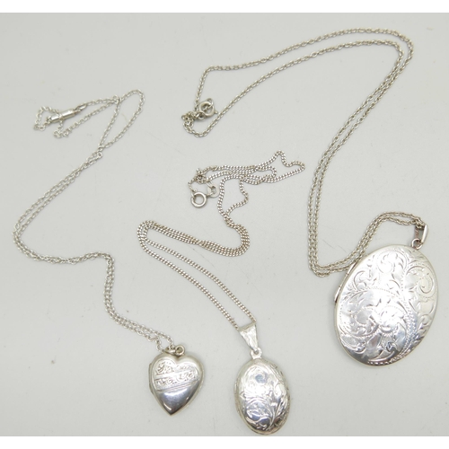 949 - Three silver lockets and chains, the largest by Fred Manshaw measuring 5cm including bale, 24g total