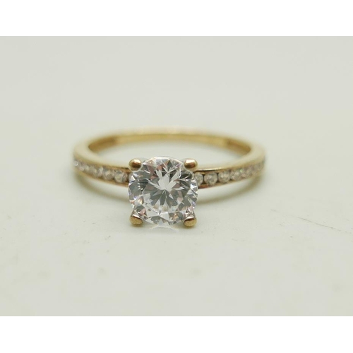 988 - A 9ct gold ring set with white stones, 1.7g, M