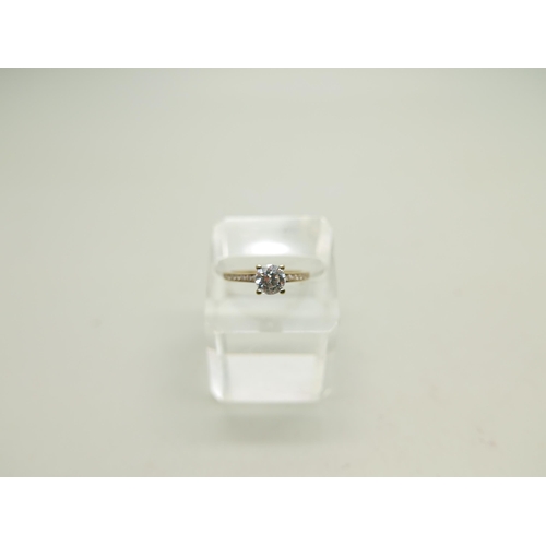 988 - A 9ct gold ring set with white stones, 1.7g, M