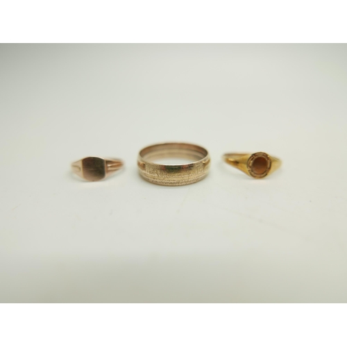 989 - Two 9ct gold signet rings, 1.8g total, size E and K, together with a rolled gold ring