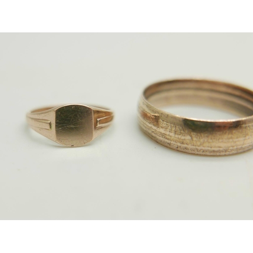 989 - Two 9ct gold signet rings, 1.8g total, size E and K, together with a rolled gold ring