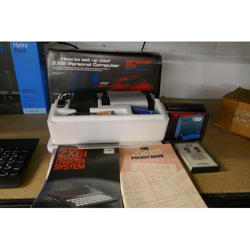 2139 - A Sinclair ZX81 Personal computer with basic programming book and pocket book, a ZX81 printer with i... 