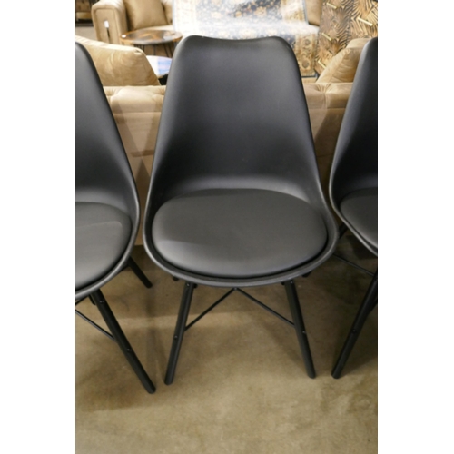 1364 - A set of four black Eames style dining chairs *This lot is subject to VAT