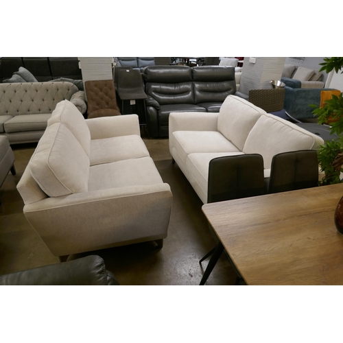 1376 - An off white fabric pair of two seater Sofas