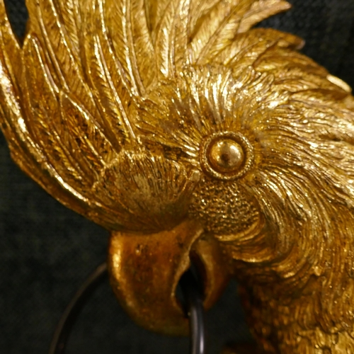 1381 - A gold wall mounted lamp in the form of a parrot