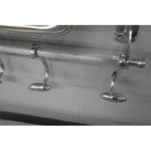 1383 - A polished chrome luggage rack