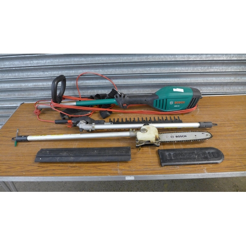 2221 - A Bosch AMW10 electric long reach garden multi tool with hedge cutter and chainsaw attachments