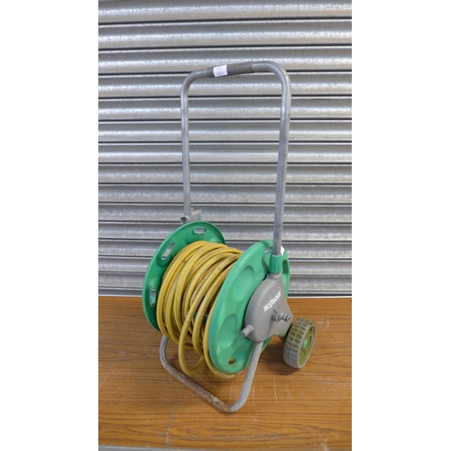 2223 - A Hozelock hose reel with hose on wheels