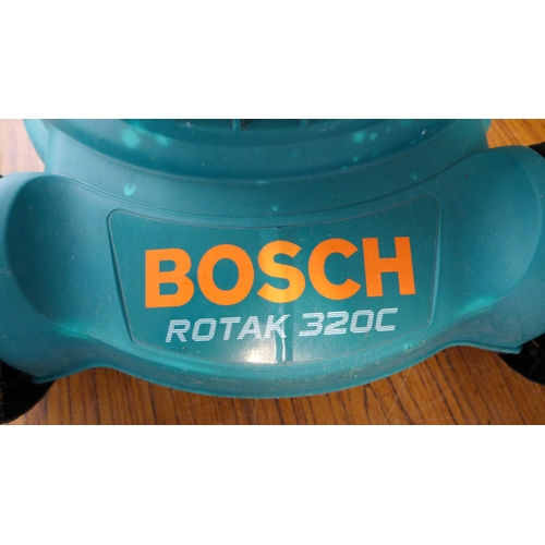 2232 - A BOSCH Rotak 320c electric lawn mower, a Qualcast HC35 electric hedge cutter and a hose pipe and re... 