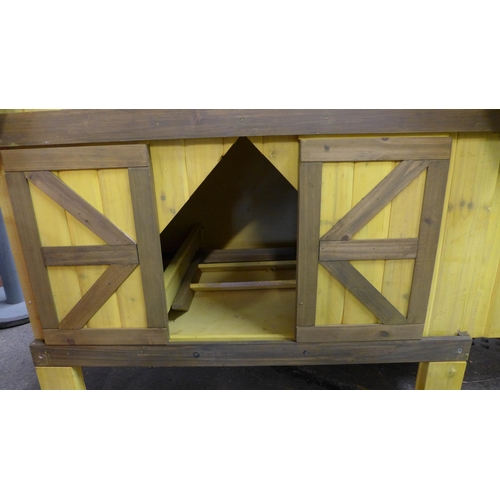 2261 - A yellow painted chicken coop - boxed