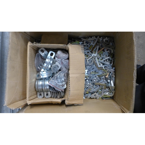 2297 - A large quantity of galvanized fittings including racking pins and wall brackets