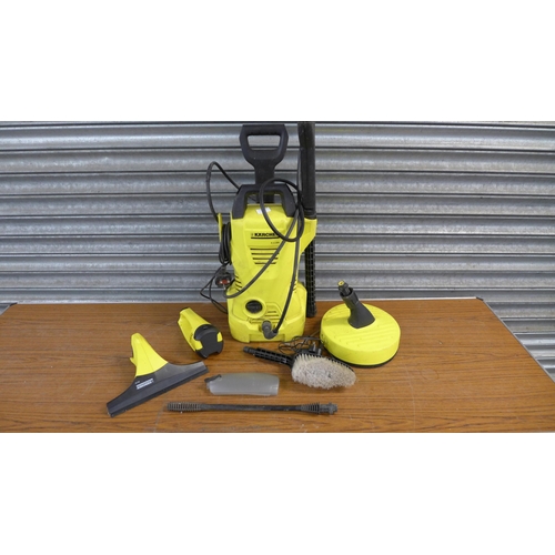 2304 - A Karcher K2.395 pressure washer with hose, lance, brush and patio cleaner attachment and a Karcher ... 