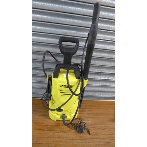 2304 - A Karcher K2.395 pressure washer with hose, lance, brush and patio cleaner attachment and a Karcher ... 