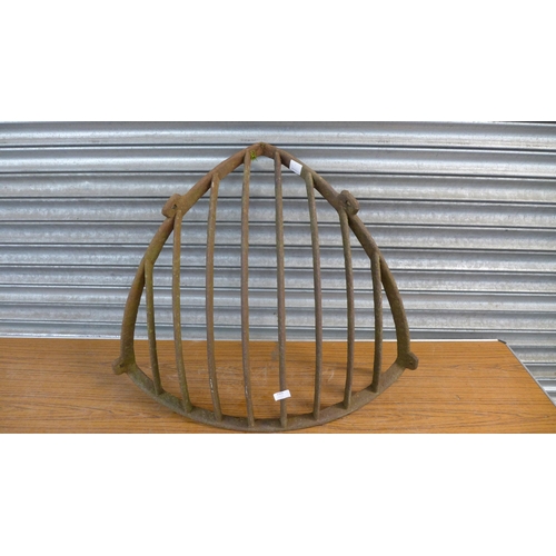 2305 - A cast metal corner hay rack