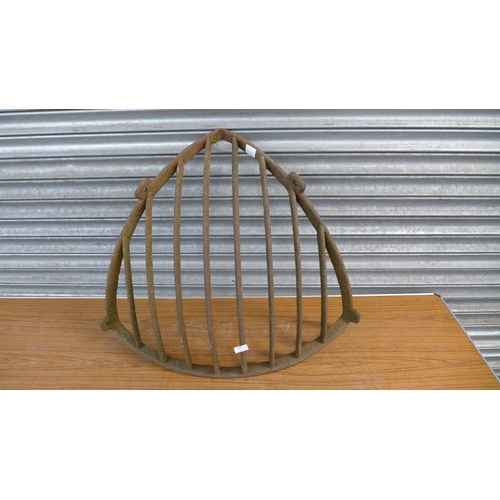 2305 - A cast metal corner hay rack