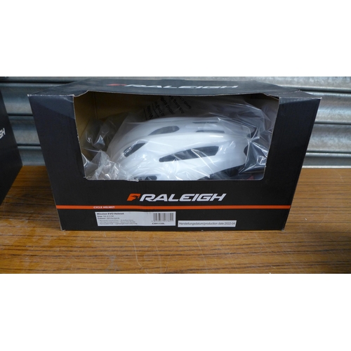 2329 - 4 Raleigh mission Evo bicycle helmets - size 56-61cm - white/pink