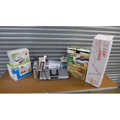 2335 - A quantity of household electronics, a Polti Inox Vaporetto TPFER1000 steam iron, a Tefal Clipso Vit... 