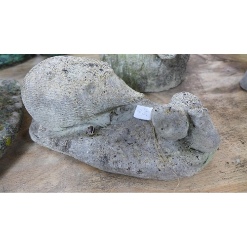 2339 - Three assorted concrete garden ornaments including a pixie, a frog on a toadstool mushroom and a hed... 