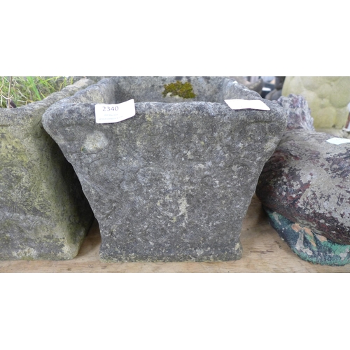 2340 - A set of four stone effect concrete square planters